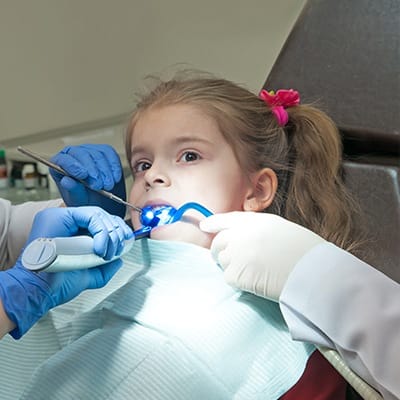 child receiving dental sealants