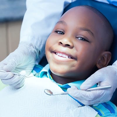 Little boy getting a dental exam 