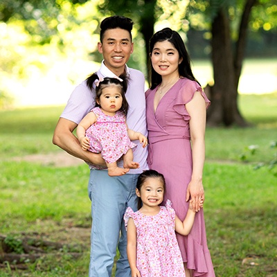 Dr. Justin and his family smiling together