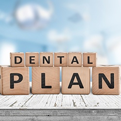 Kids’ blocks spelling “dental plan”