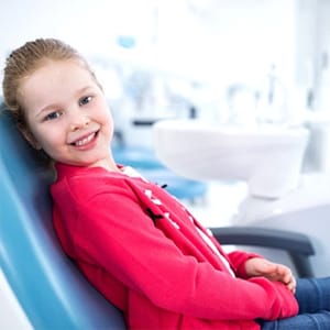 young girl in dental chair