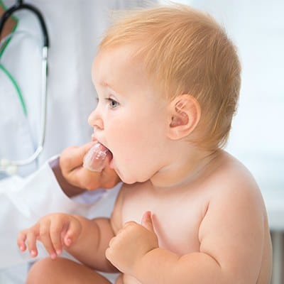 Dentist checking baby's teeth