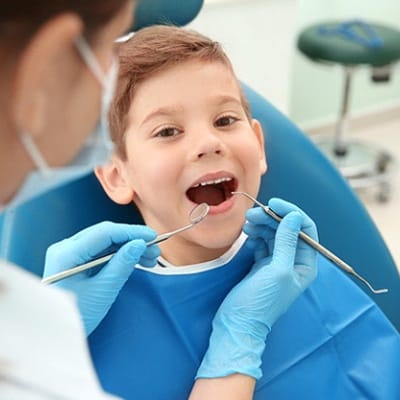 A little boy in the dentist chair