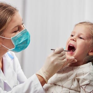 A little girl in the dentist chair