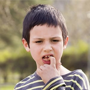 Little boy pointing to tooth