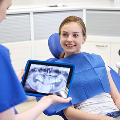 Smiling woman in dental chair