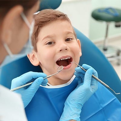 Little boy in dental chair during exam