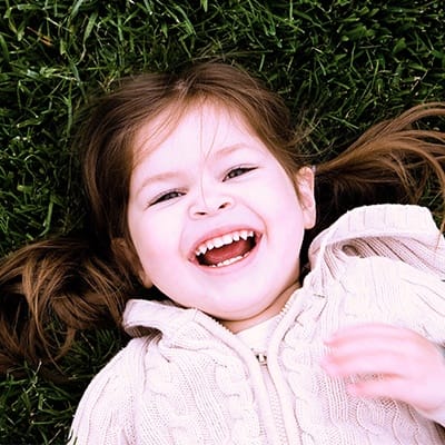 Laughing little girl outside