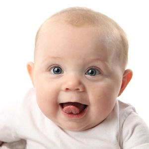 A baby sticking its tongue out after having its tongue tie in McKinney released