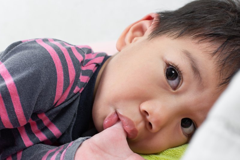 little boy sucking his thumb