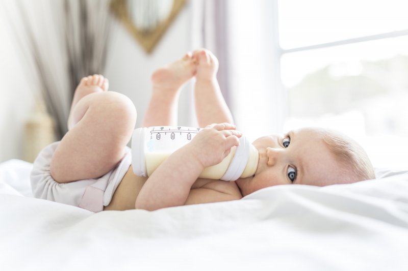 baby with a bottle of milk