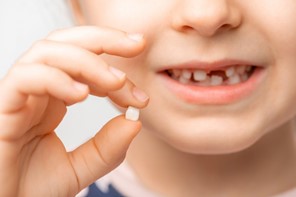 a child with a missing tooth