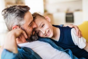 child and parent resting after children’s tooth extraction