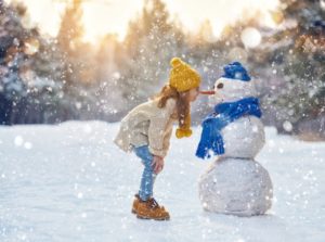 girl snowman winter