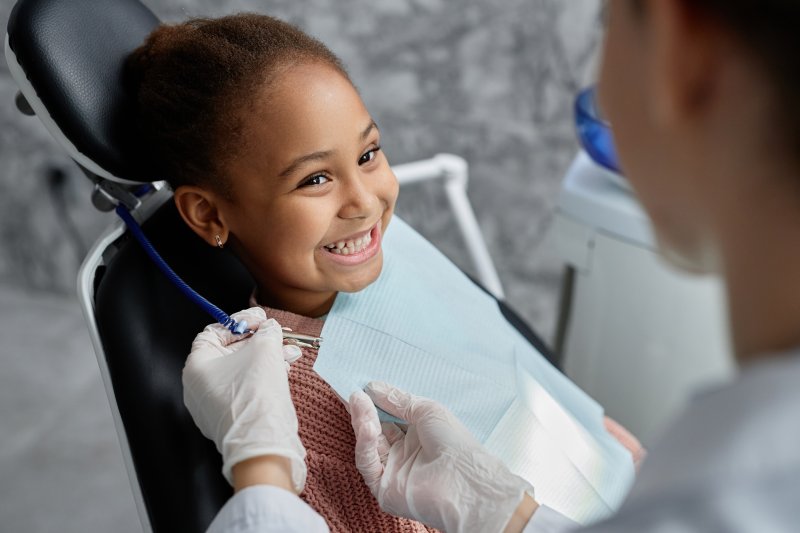 little girl seeing her pediatric dentist