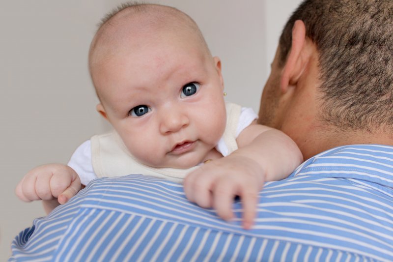 father holding a baby